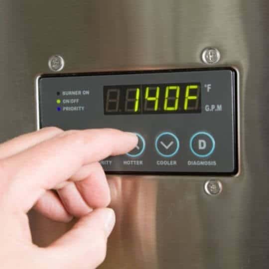 men_clicking_on_digital_tankless_water_heater_thermometer.jpeg