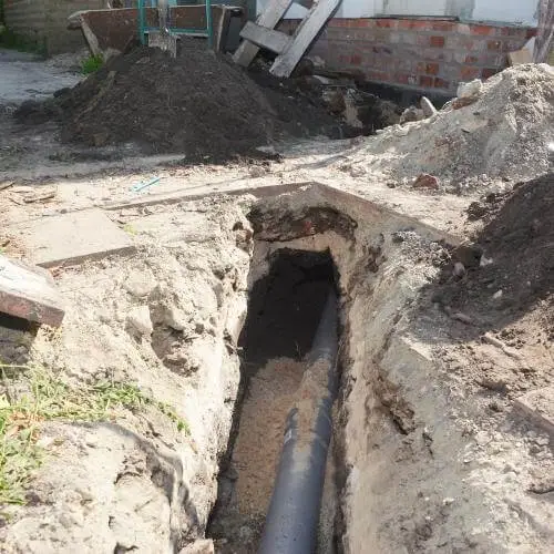 digging_trench_for_sewer_line.jpeg