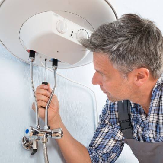 plumber_installing_40_gallon_water_heater.jpeg
