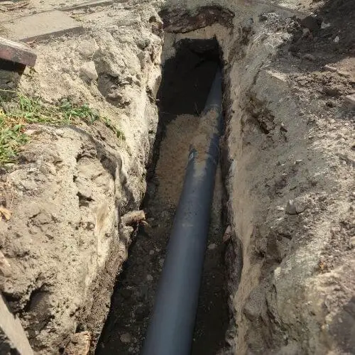sewer_pipe_in_ground.jpeg