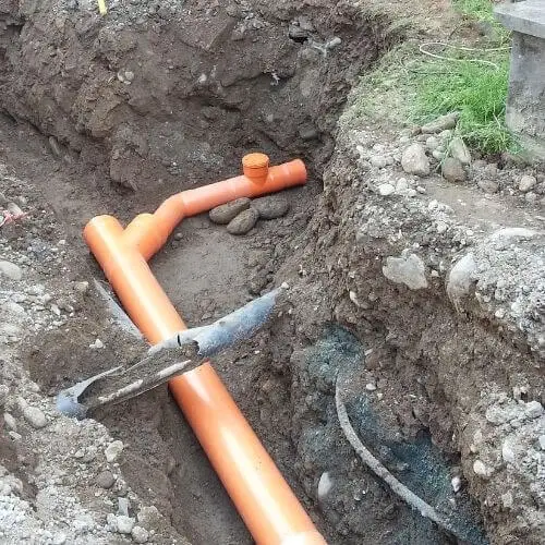 orange_pipes_in_ground.jpeg